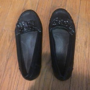 Black tassel flats